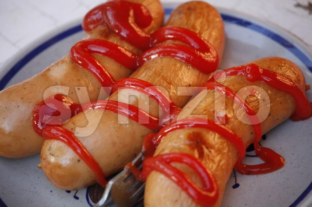 Sausages and Ketchup Stock Photo